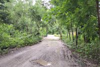 Ruas jalan Molo Oetun yang tidak dikerjakan meski ada dalam papa informasi proyek